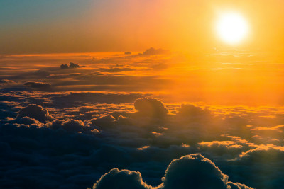 Sunset over the clouds.